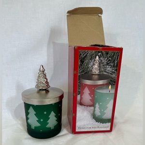 Never used. Christmas tree green frosted glass votive with lid. Wax candle.